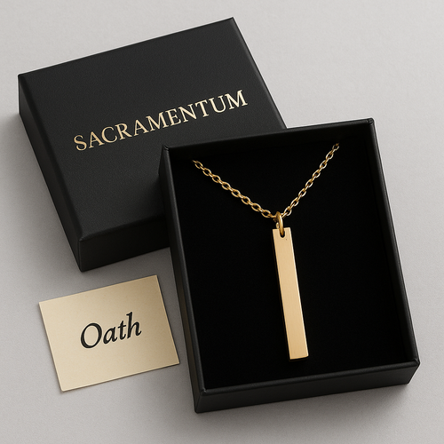 Gold necklace in a black 'Sacramentum' box with a gold card labeled 'Oath'.